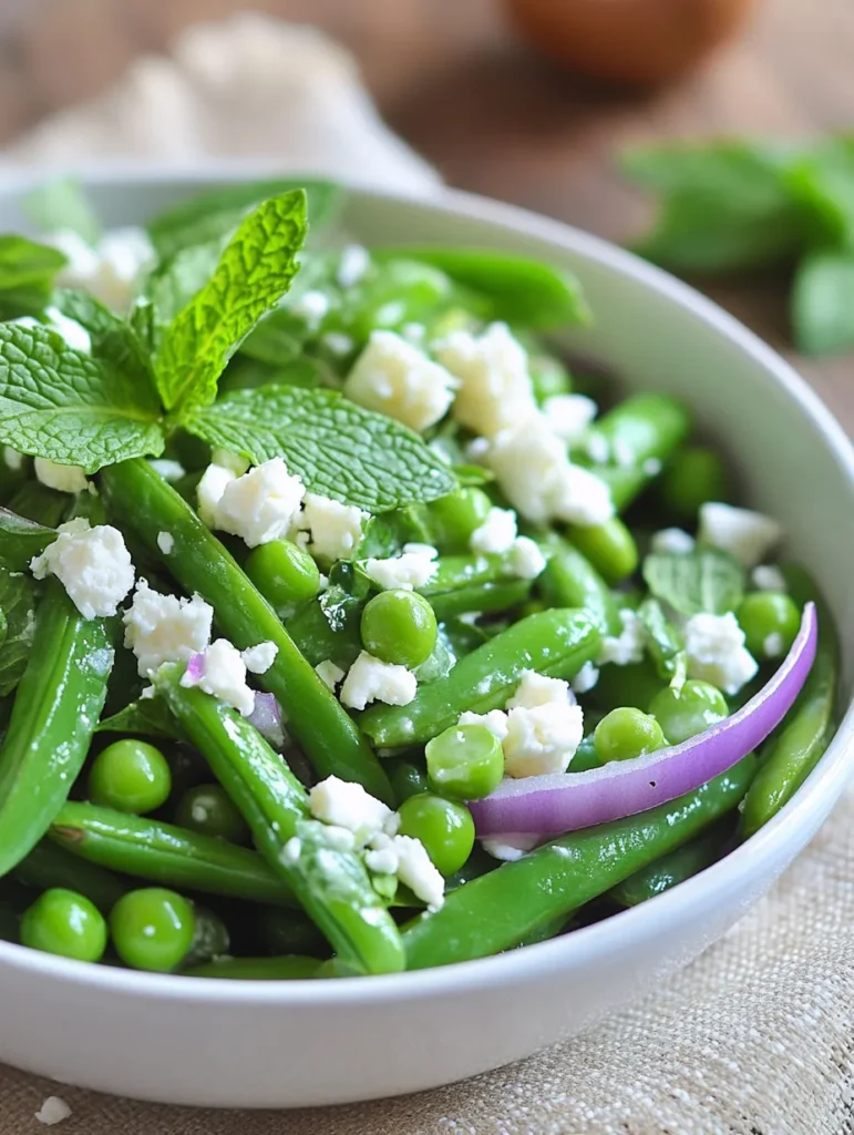 Raw ingredients for Spring Snap Pea Salad including fresh peas, herbs, and lemon arranged on wooden board