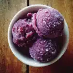 Homemade grape sorbet hack served in regular glass bowls with simple garnish
